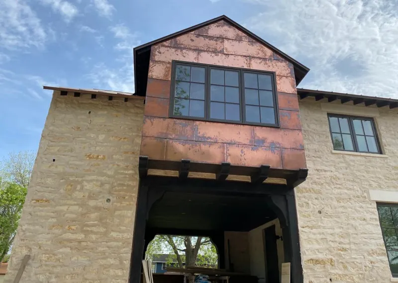 Copper metal panel facade on a stone building for Roof Repair in Mountain House